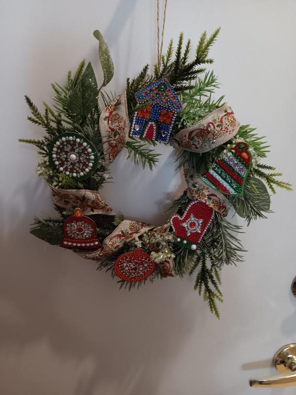 
Diamond art ornaments on an evergreen miniwreath. 